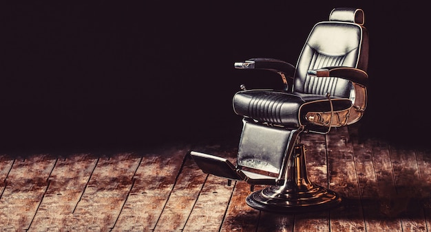 Barber shop chair. Barbershop armchair, modern hairdresser and hair salon, barber shop for men. Stylish vintage barber chair. Professional hairstylist in barbershop interior.