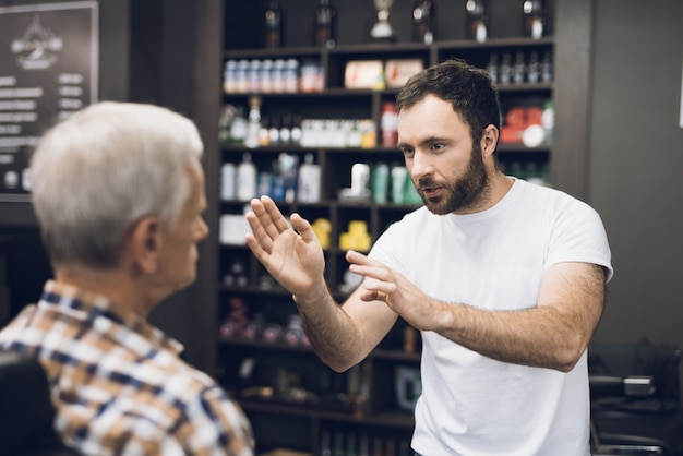 Barber Talk Client in Hairdressing Studio.