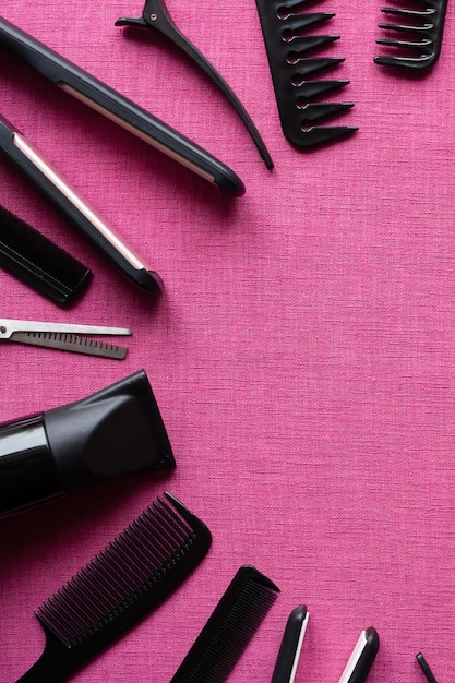 Barber tools on a pink background and space for text