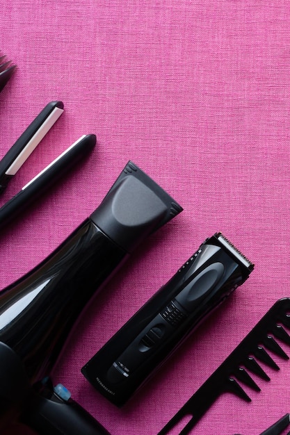 Barber tools on pink background