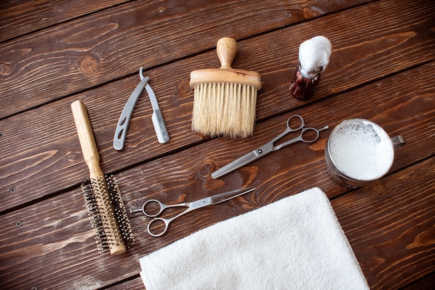 Barbershop accessories on wooden table. Barbershop background copy space