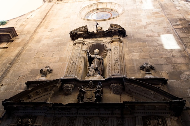 Barcelona, Catalonia, Spain, September 22, 2019. Details of the exterior historical buildings. Ancient bas-reliefs on the windows and walls. Architectural design elements.