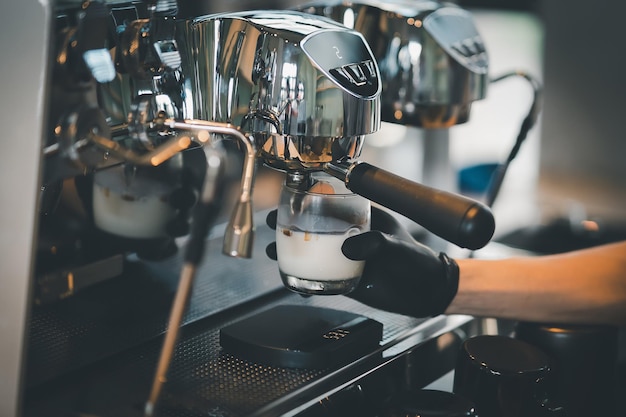 Barista cafe making coffee preparation service concept in restaurant Close up hand barista making fresh coffee with coffee machine in the cafe Making fresh coffee espresso