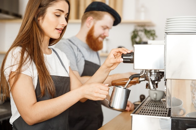 Barista couple working in the coffee shop