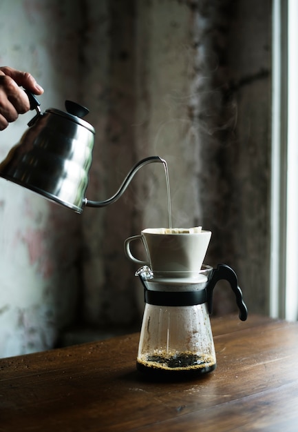 Barista hand dripping brewed coffee