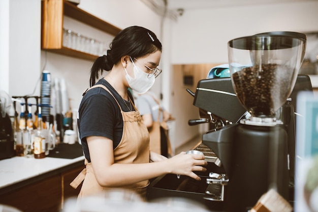 Barista making coffee with professional machine Coffee pouring into a cup small business startup bus