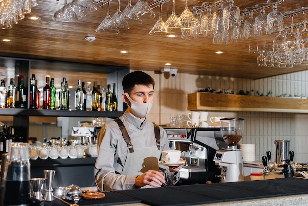 The barista prepares coffee in a modern cafe.