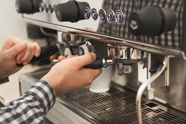 Barista working at his coffee shop