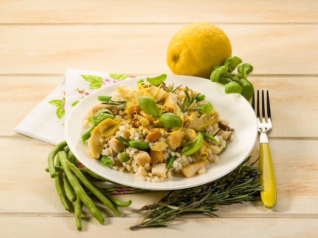 Barley risotto with mushroom artichoke white meat and green beans