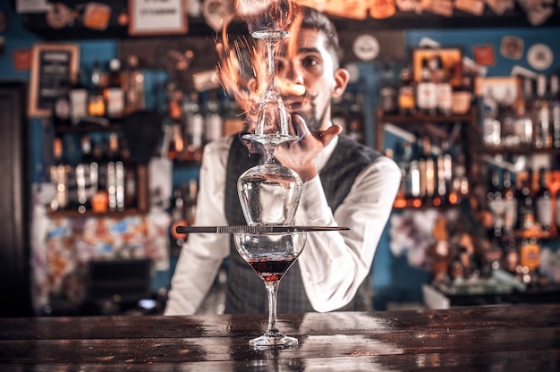 Barman concocts a cocktail on the pothouse