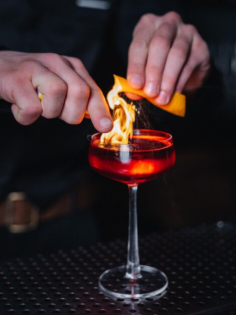 barman making cocktail in the bar