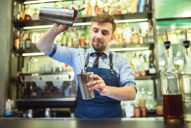 The barman working on the bar