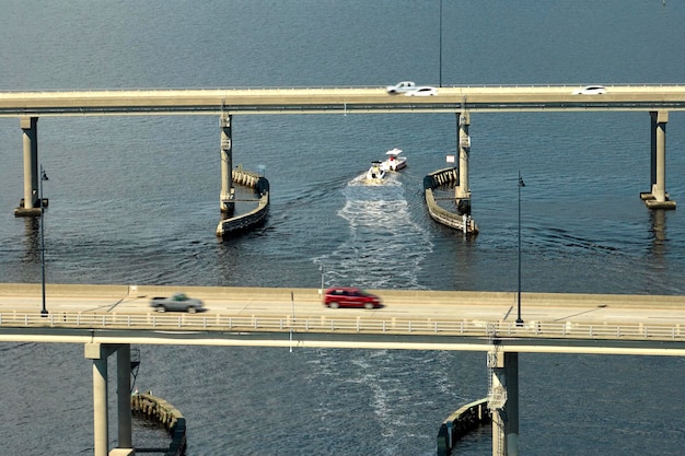 Barron Collier Bridge and Gilchrist Bridge in Florida with moving traffic Transportation infrastructure in Charlotte County connecting Punta Gorda and Port Charlotte over Peace River