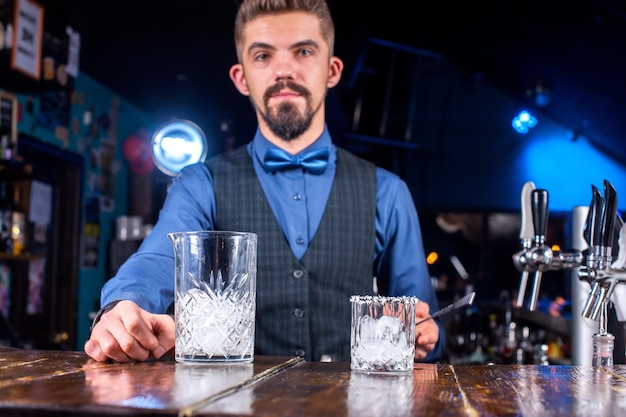 Bartender creates a cocktail at the taproom