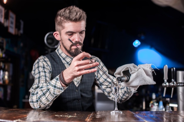 Bartender makes a cocktail in the beerhall