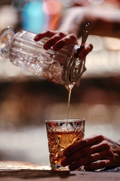 Bartender makes a cocktail