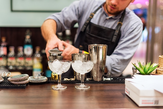 Bartender making cocktails in a club