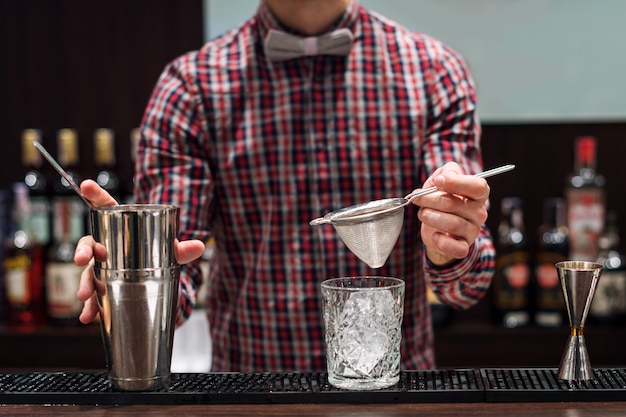 Bartender making cocktails in a club