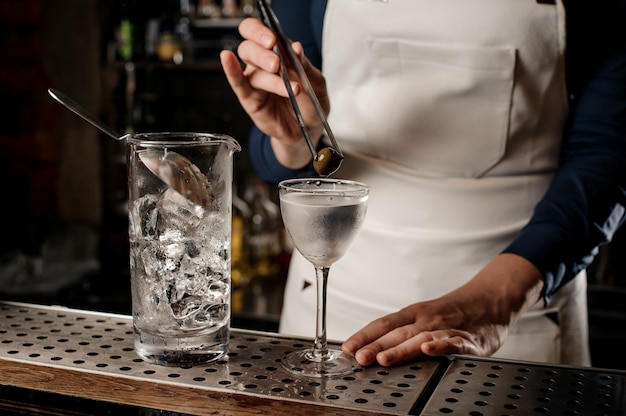 Bartender making a fresh cocktail at the bar