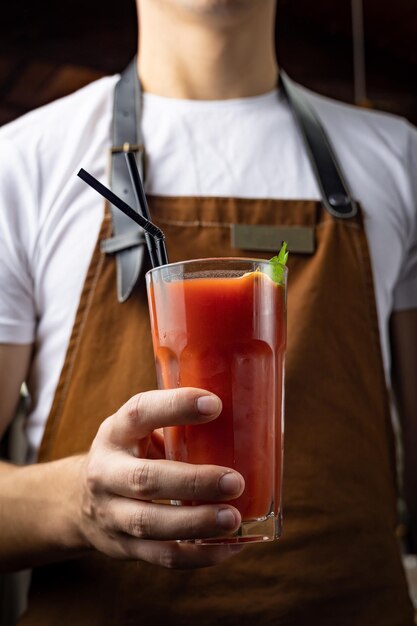 A bartender prepares a cocktail at the restaurant bar