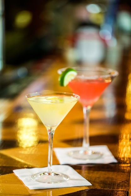 Bartender preparing Limoncello martini coctail.