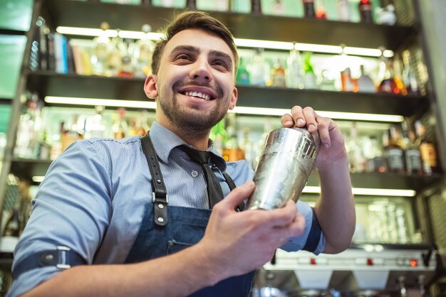 The bartender working with a bar equipment