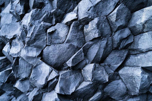 Basalt stones as a background Reynisfjara Beach Iceland Sharp rocks Photography for design Textures in nature