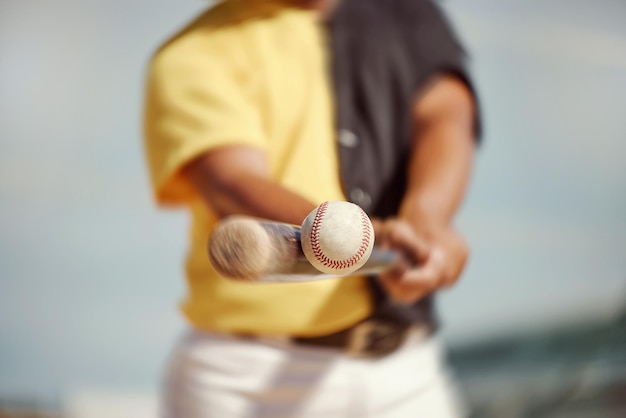 Baseball baseball player and black man hit ball on field in match game or competition Fitness sports and closeup of baseball batter with baseball bat outdoors for training workout or exercise