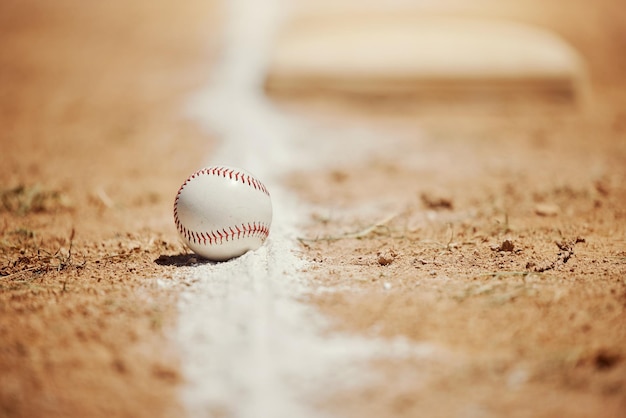 Baseball chalk line and ball on field before sports game training and practice Competition motivation and sport equipment on baseball field ground Isolated close up and copy space for softball