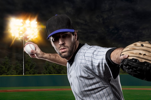 Baseball Player on a Blue Uniform on baseball Stadium.