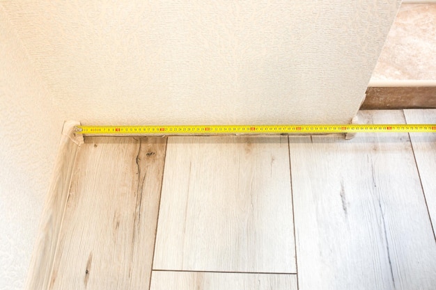 Baseboard installation Repair works indoors Renovation in the flat Tape measure