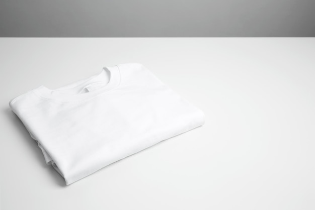 Basic folded white tshirt Mock up for branding tshirt Copy space