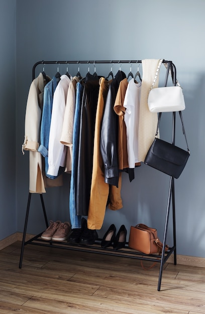 Photo basic women's autumn wardrobe with shoes and handbags on  hanger