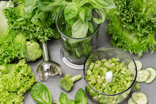 Basil and celery stalks in a blender