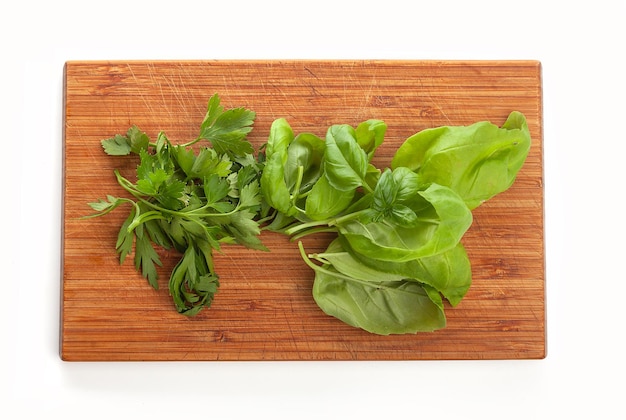 Basil leaves on the wooden board