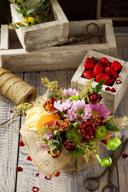 Basket bouquet of roses and chrysanthemums