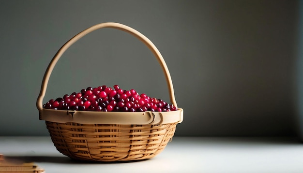 A basket of cranberries is sitting on a table.