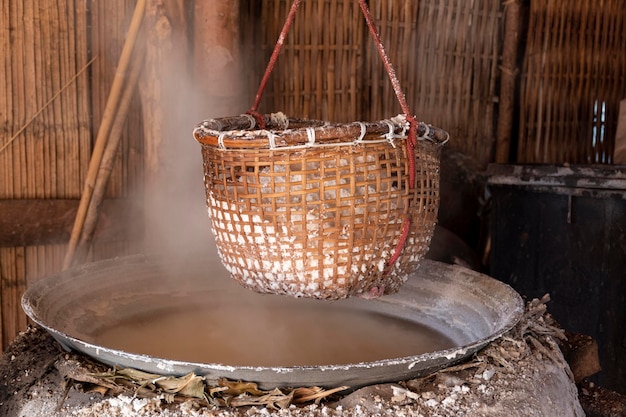 Basket of salt obtained from boiling mountain salt has only one place in world at Bo Kluea Thailand