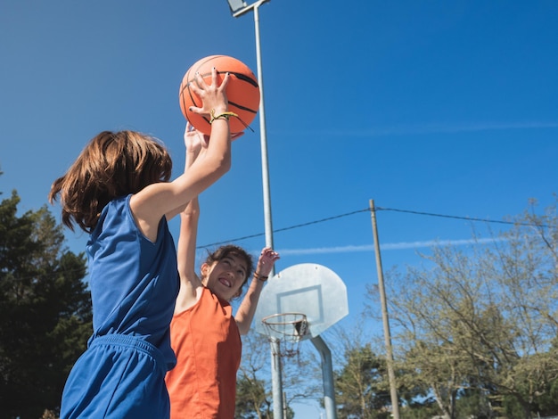 Basket shot in a one on one between two boys