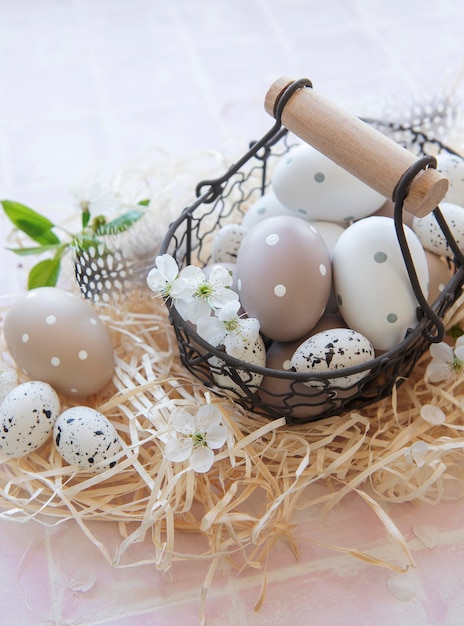 A basket with Easter eggs on straw