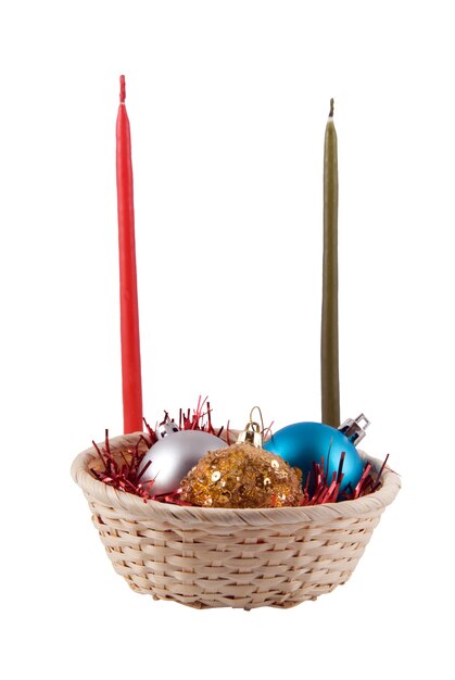 Photo basket with three christmas ball blue gold both grey and two candles red and green