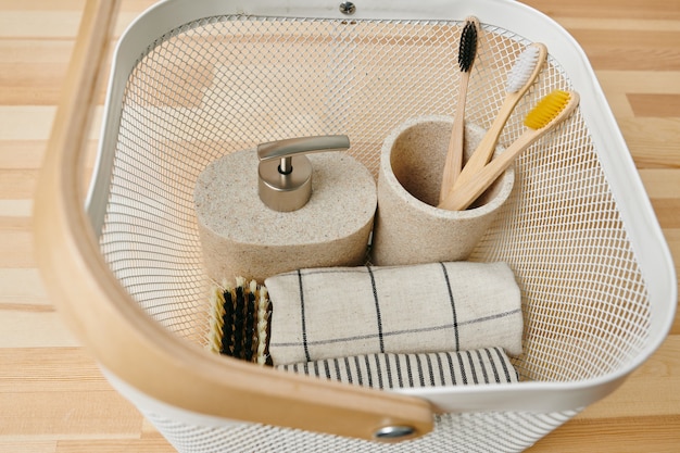 Photo a basket with a variety of bodycare items in it on wooden table or shelf