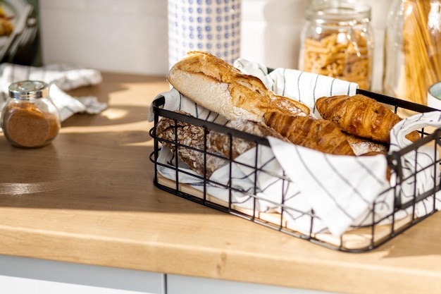 Basket with various baked goods on the kitchen home table