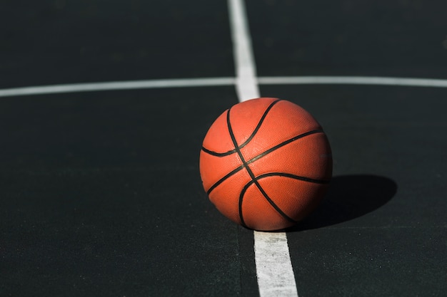 Basketball on court outdoors