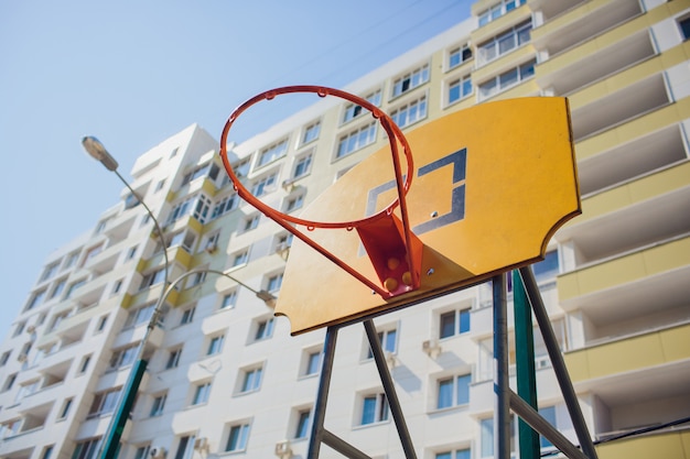 Basketball hoop with backboard in residential district for street basketball game