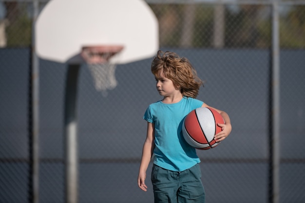 Basketball kids training game. American child with Basket ball.