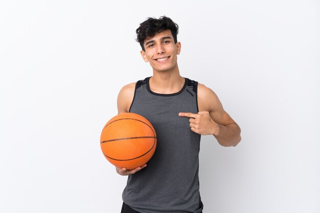 Basketball player man over isolated white wall with surprise facial expression