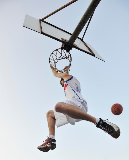 basketball player practicing and posing for basketball and sports athlete concept