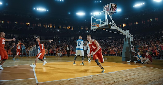 Basketball players on big professional arena during the game Tense moment of the game Celebration