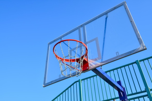 basketball shield and basket on a blue sky background